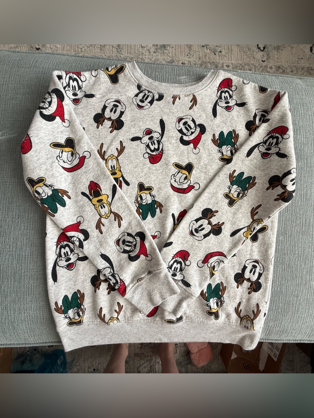 Unisex Disney Cream Crewneck Sweatshirt with Red and Green Holiday Accents